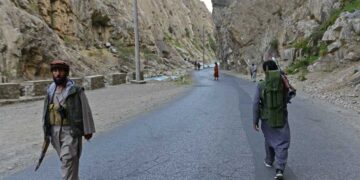 (FILES) In this file photo taken on August 29, 2021, Afghan resistance movement and anti-Taliban uprising forces personnel patrol along a road in Rah-e Tang of Panjshir province. - The Taliban said on September 6, 2021 the last pocket of resistance in Afghanistan, the Panjshir Valley, had been "completely captured". (Photo by Ahmad SAHEL ARMAN / AFP)