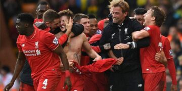 Norwich : Liverpool's Adam Lallana, third left, celebrates with his teammates and manager Jurgen Klopp, second right, after scoring his side's fifth goal during their English Premier League soccer match against Norwich City at Carrow Road, Norwich, England, Saturday, Jan. 23, 2016. AP/PTI(AP1_24_2016_000001B)