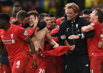 Norwich : Liverpool's Adam Lallana, third left, celebrates with his teammates and manager Jurgen Klopp, second right, after scoring his side's fifth goal during their English Premier League soccer match against Norwich City at Carrow Road, Norwich, England, Saturday, Jan. 23, 2016. AP/PTI(AP1_24_2016_000001B)