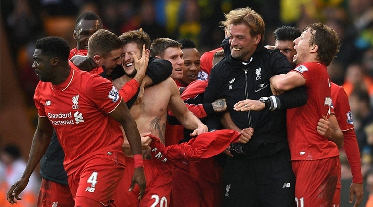 Norwich : Liverpool's Adam Lallana, third left, celebrates with his teammates and manager Jurgen Klopp, second right, after scoring his side's fifth goal during their English Premier League soccer match against Norwich City at Carrow Road, Norwich, England, Saturday, Jan. 23, 2016. AP/PTI(AP1_24_2016_000001B)