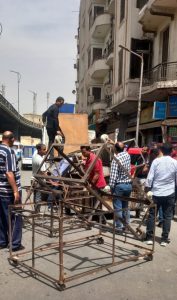 محافظة الجيزة تزيل تعديات علي الطريق العام وبروز لمحال تجارية وأكشاك بشوارع ربيع الجيزي والمحطة والأهرام وميدان الجيزة 59 - جريدة المساء