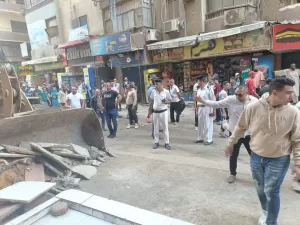 بالصور- أكبر حملة إشغالات بالجيزة | إزالة تعديات المحال التجارية والباعة الجائلين من الطريق العام بفيصل 31 - جريدة المساء