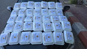 أمانة المرأة بحزب الشعب الجمهوري بقنا توزع 500 وجبة ساخنة على الصائمين بمواقف السيارات 41 - جريدة المساء