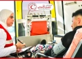 الشاب مع الزميلة منار إبراهيم المستشار الإعلامى للهلال الأحمر